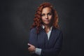 Redhead female supervisor dressed in an elegant suit. Royalty Free Stock Photo