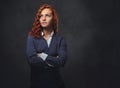 Redhead female supervisor dressed in an elegant suit. Royalty Free Stock Photo