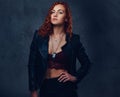 Redhead female supervisor dressed in an elegant suit. Royalty Free Stock Photo