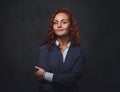 Redhead female supervisor dressed in an elegant suit. Royalty Free Stock Photo