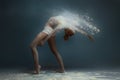 Redhead fitness girl female adult woman dancer in dust Royalty Free Stock Photo