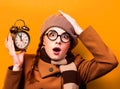 Redhead girl with alarm clock Royalty Free Stock Photo