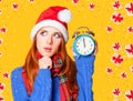 Redhead girl with alarm clock Royalty Free Stock Photo