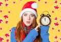 Redhead girl with alarm clock Royalty Free Stock Photo