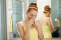 Young Woman Applies Anti Age Cream On Face Smiling Royalty Free Stock Photo