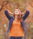 Redhead girl at autumn outdoor Royalty Free Stock Photo