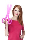 Redhead girl with big scissors Royalty Free Stock Photo