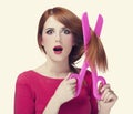 Redhead girl with big scissors Royalty Free Stock Photo