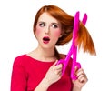 Redhead girl with big scissors Royalty Free Stock Photo