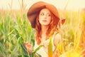 Redhead girl in corn field