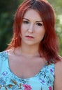 Redhead girl enjoying summer sunlight and calm wind Royalty Free Stock Photo