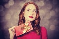 Redhead girl with gift for Valentines Day Royalty Free Stock Photo