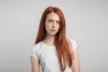 Redhead girl with healthy freckled skin looking at camera Royalty Free Stock Photo