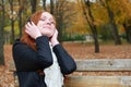 Redhead girl listen music in city park, fall season Royalty Free Stock Photo