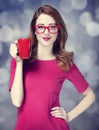 Redhead girl with red cup. Royalty Free Stock Photo