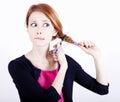 Redhead girl with scissors. Royalty Free Stock Photo