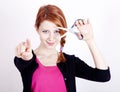 Redhead girl with scissors. Royalty Free Stock Photo