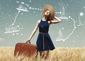 Redhead girl with suitcase at spring wheat field. Royalty Free Stock Photo