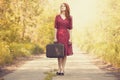 Redhead girl with suitcase