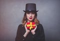 Redhead girl in top hat with gift box Royalty Free Stock Photo