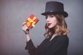 Redhead girl in top hat with gift box Royalty Free Stock Photo