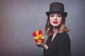 Redhead girl in top hat with gift box Royalty Free Stock Photo