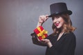 Redhead girl in top hat with gift box Royalty Free Stock Photo