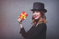 Redhead girl in top hat with gift box Royalty Free Stock Photo