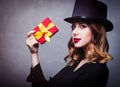 Redhead girl in top hat with gift box Royalty Free Stock Photo