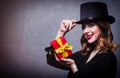 Redhead girl in top hat with gift box Royalty Free Stock Photo