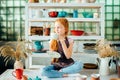 Girl wih many cups made from clay sitting in pottery studio Royalty Free Stock Photo