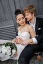 redhead groom hugging african american bride Royalty Free Stock Photo