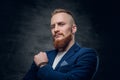 Redhead hipster male dressed in a blue jacket. Royalty Free Stock Photo