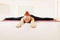 Redhead laying down on floor legs stretched