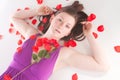 Redhead laying with rose Royalty Free Stock Photo