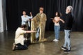 redhead man in king costume rehearsing