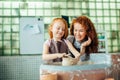 Mother and daughter mold with clay on pottery