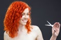 Redhead with scissors Royalty Free Stock Photo