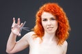 Redhead with scissors Royalty Free Stock Photo