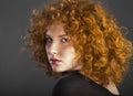 Redhead curly young woman