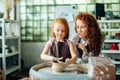 Teacher and student make pitcher of pottery wheel Royalty Free Stock Photo