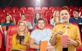 Redhead teenage girl with popcorn at movie theater Royalty Free Stock Photo