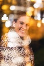 Redhead urban woman in leopard pattern coat at winter city lights toothy smile at night, Double exposure technique
