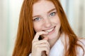 Redhead woman in bathrobe looking at camera Royalty Free Stock Photo