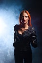 Redhead woman in a black leather jacke Royalty Free Stock Photo