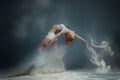 Redhead woman dancer in dust Royalty Free Stock Photo