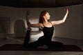 Redhead woman exercising hatha yoga