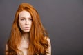 Redhead woman,eyelashes, perfect skin. girl,shiny wavy hair Royalty Free Stock Photo
