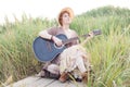 Redhead woman with guitar