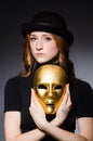 Redhead woman in hat iwith mask in hypocrisy consept Royalty Free Stock Photo